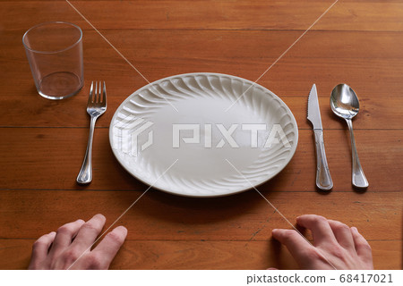 Point of view of a person about to eat on an empty Point of view of a person about to eat on an empty 68417021