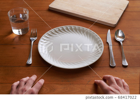 Point of view of a person about to eat on an empty Point of view of a person about to eat on an empty 68417022
