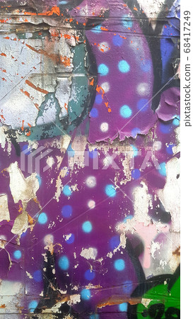 Old weathered colorful paint that separates from rusty metal and peels off 68417249