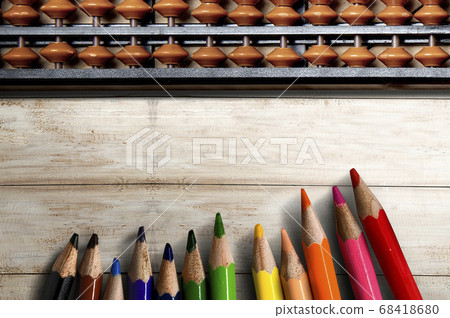 Abacus and colored pencils on wooden table 68418680
