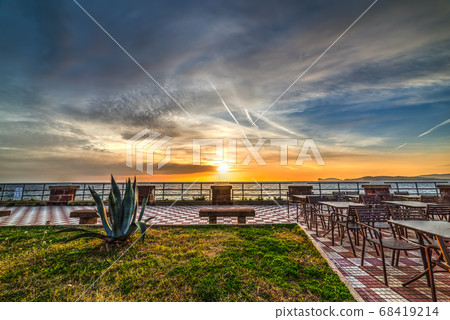 Colorful sunset in Alghero seafront 68419214
