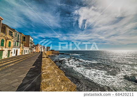 Alghero seafront under clouds Alghero seafront under clouds 68420211