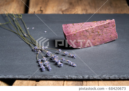 Lavender cheese with bunch of fresh lavender flowers on rough wooden planks 68420673
