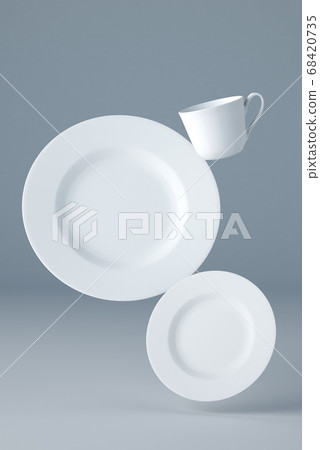 Mockup of two white plates and a cup levitating on blue background Mockup of two white plates and a cup levitating on blue background 68420735