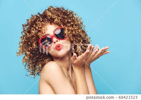 Charming model dancing on an isolated background, fashion sunglasses 68421523
