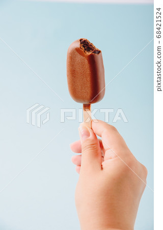 Chocolate cake in the form of ice cream on a stick Chocolate cake in the form of ice cream on a stick 68421524