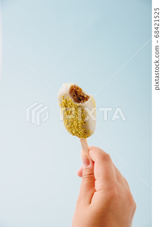 Chocolate cake in the form of ice cream on a stick Chocolate cake in the form of ice cream on a stick 68421525