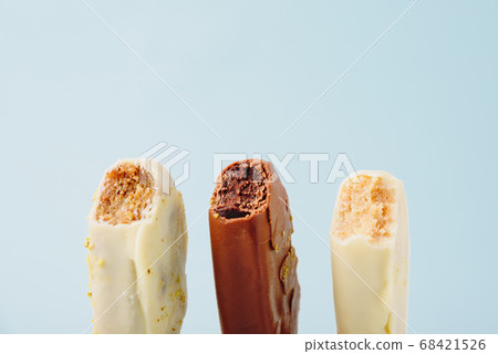 Chocolate cake in the form of ice cream on a stick Chocolate cake in the form of ice cream on a stick 68421526