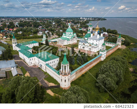 Aerial summer view of white Spaso-Yakovlevsky Monastery with green domes in Rostov the Great city. Russia. Aerial summer view of white Spaso-Yakovlevsky Monastery with green domes in Rostov the Great city. Russia. 68422323