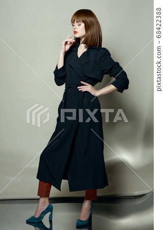 Fashionable model cloak photo studio modern style Beautiful face 68422388