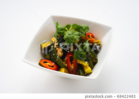 Traditional oriental salad of fresh vegetables in a deep white bowl on a white background, isolate. Traditional oriental salad of fresh vegetables in a deep white bowl on a white background, isolate. 68422483