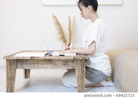 Young woman doing sutras at home 68422725