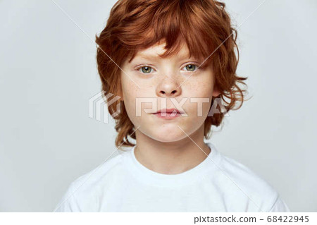 Cute redhead boy freckles on his face cropped view  68422945