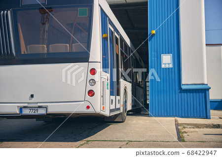 Big bus arriving at the car wash station 68422947