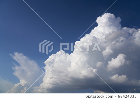 Big white fluffy cloud on blue sky Big white fluffy cloud on blue sky 68424333