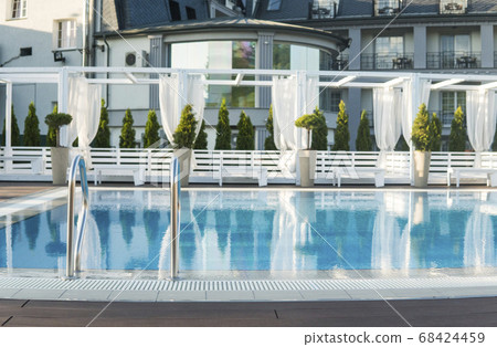 Swimming pool with stair at sunny day. Swimming pool with stair at sunny day. 68424459