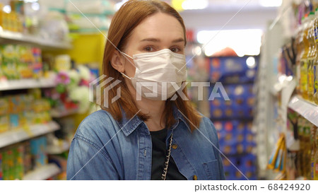 woman Buyer wearing a protective mask. woman Buyer wearing a protective mask. 68424920