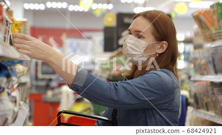 woman Buyer wearing a protective mask. woman Buyer wearing a protective mask. 68424921