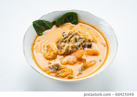Traditional Asian soup with chicken or pig meat with udon noodles in a white bowl, isolate. Traditional Asian soup with chicken or pig meat with udon noodles in a white bowl, isolate. 68425049