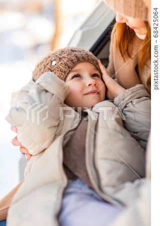Mammy's daughter in winter clothes 68425064