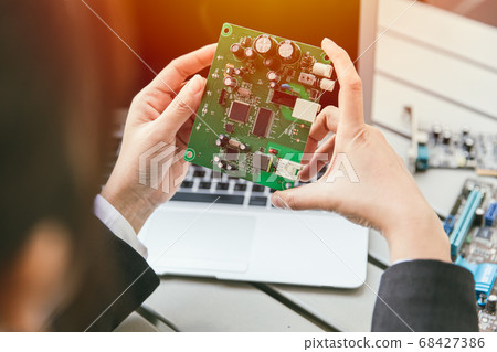 Engineer inspect final production of Printed circuit computer logic board 68427386