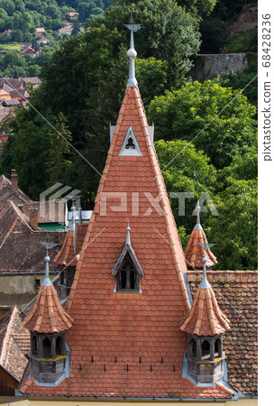 Aerial view on red tiled roofs of medieval Brasov town in Transylvania, Romania. Europe 68428236