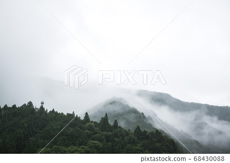 Mountain landscape with clouds in bad weather 68430088