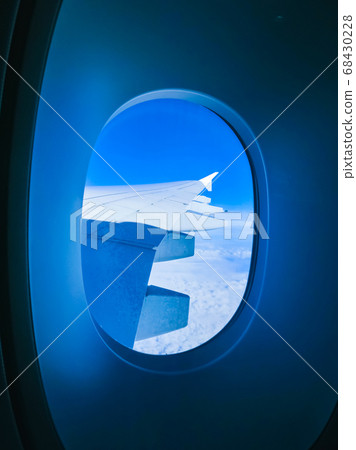 View from an airplane on a blue sky and white 68430228