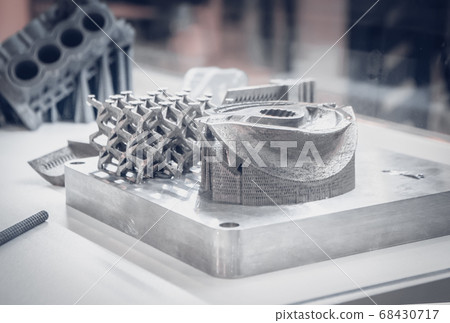 Man is holding object printed on metal 3d printer. 68430717