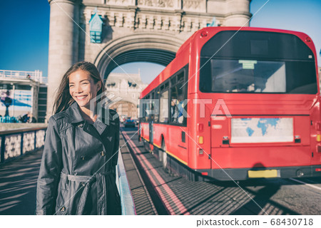 London travel tourist walking on Tower bridge street by red british bus on famous tourism attraction Europe summer vacation destination London travel tourist walking on Tower bridge street by red british bus on famous tourism attraction Europe summer vacation destination 68430718