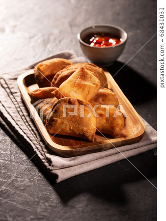 Typical Colombian empanadas served with spicy Typical Colombian empanadas served with spicy 68431031