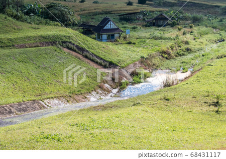 Flowing water from the concrete spillway. 68431117