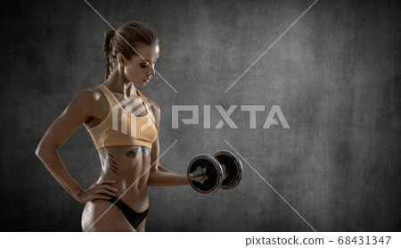 young fitness woman with dumbbells young fitness woman with dumbbells 68431347