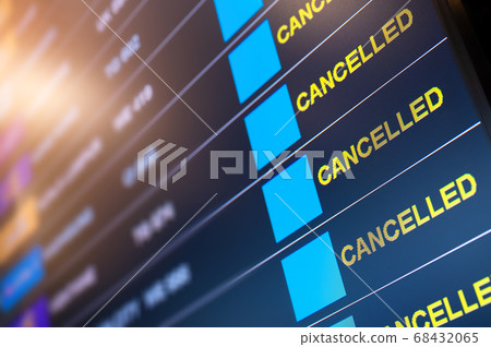 Flights cancelled on information time table board in airport 68432065