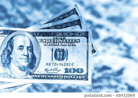 Girl holding money bill of 300 dollars on background of sea ocean 68432069