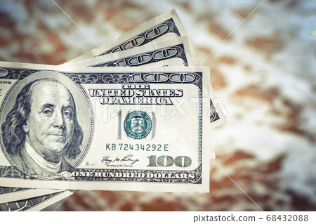 Girl holding money bill of 300 dollars on background of sea ocean Girl holding money bill of 300 dollars on background of sea ocean 68432088