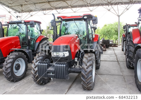 The colorful tractors in the road The colorful tractors in the road 68432213