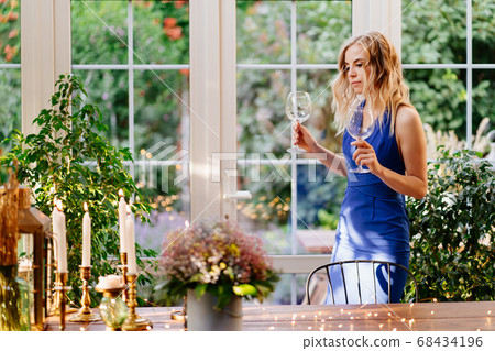 girl sets table, wine and glasses. romantic dinner 68434196