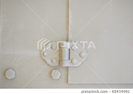 Detail of an old surface with exfoliated paint and rivets on military equipment. Military background 68434992