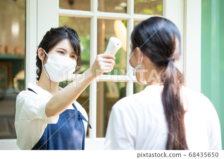 A female clerk taking a photo 68435650