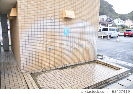 Simple shower and foot bath at the beach Simple shower and foot bath at the beach 68437419