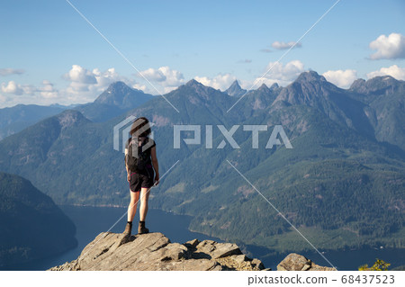 Adventurous Girl Hiking on top of Tin Hat Mountain 68437523