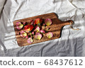 Background of flowers lined up on a wooden board 68437612