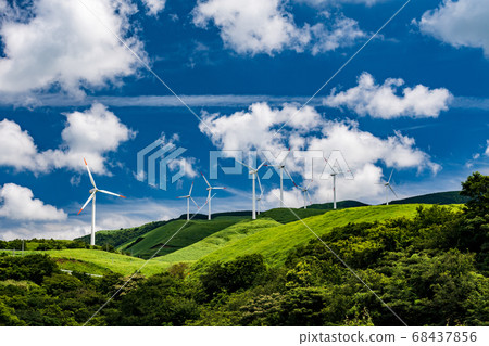Wind power turns around in summer blue sky and white clouds landscape 68437856