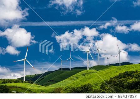 Wind power turns around in summer blue sky and white clouds landscape 68437857