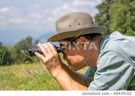 Looking hungry and looking through binoculars Side Vancouver British Columbia Canada Looking hungry and looking through binoculars Side Vancouver British Columbia Canada 68439102