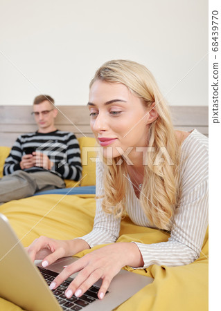 oung woman checking social media 68439770