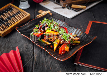 Asian warm spicy salad with beef and vegetables 68440543