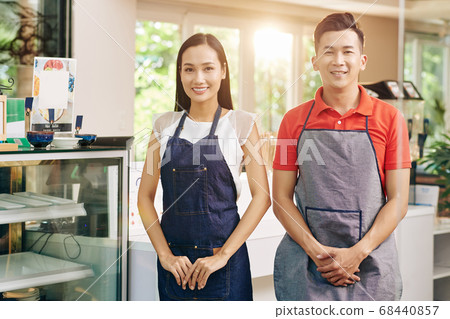 Happy cafe waiters 68440857