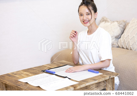 Young woman doing sutras at home Young woman doing sutras at home 68441002